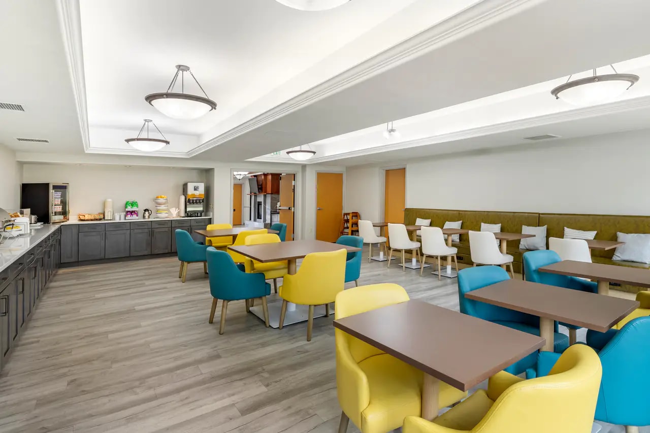 Hotel breakfast area with colorful seating